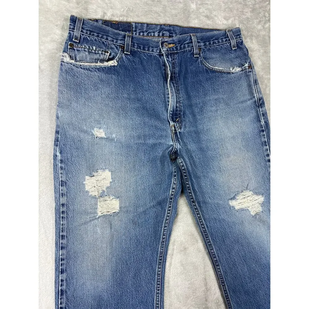 Vintage Levi's 550 Distressed Jeans 38x30 Made in USA Light Wash